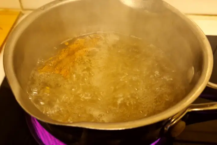 how to rehydrate peppers: chipotle simmering in water.